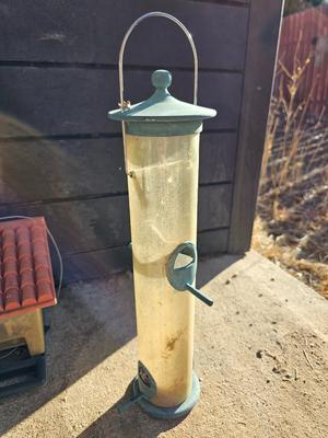 Grouping of Bird feeders and small wooden bird houses