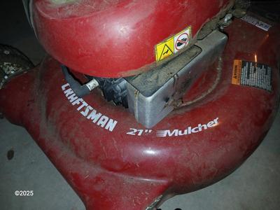Craftsman 6.5 horsepower Briggs & Stratton 21" Mower Mulcher with bag, oil, and gas can