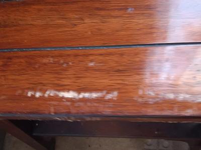 Two wooden end tables - one has damage on the corner