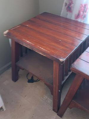 Two wooden end tables - one has damage on the corner