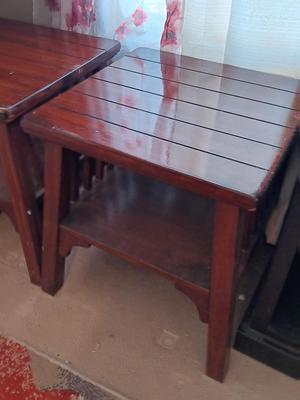 Two wooden end tables - one has damage on the corner