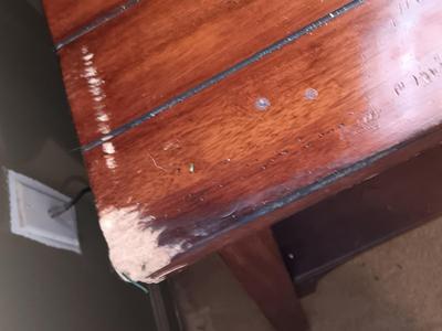 Two wooden end tables - one has damage on the corner