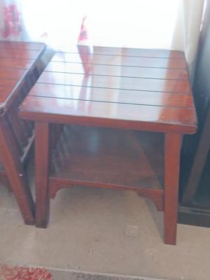 Two wooden end tables - one has damage on the corner