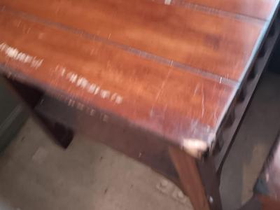 Two wooden end tables - one has damage on the corner