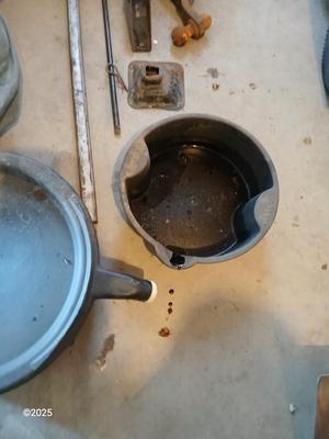Auto cover with Jack, oil pans, gas can and a trailer hitch