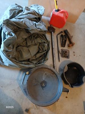 Auto cover with Jack, oil pans, gas can and a trailer hitch