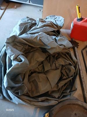 Auto cover with Jack, oil pans, gas can and a trailer hitch