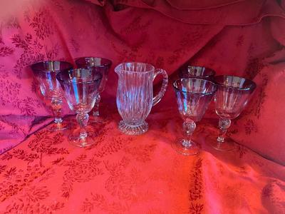 CRYSTAL PITCHER AND LARGE GLASS STEMMED GLASSES WITH PURPLE RIM