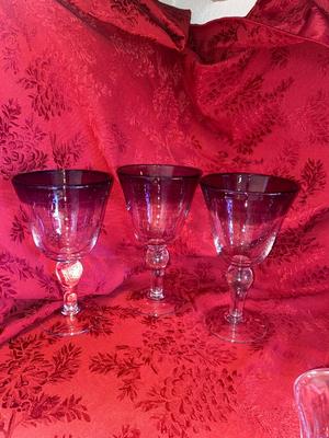 CRYSTAL PITCHER AND LARGE GLASS STEMMED GLASSES WITH PURPLE RIM