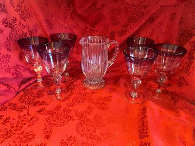 CRYSTAL PITCHER AND LARGE GLASS STEMMED GLASSES WITH PURPLE RIM
