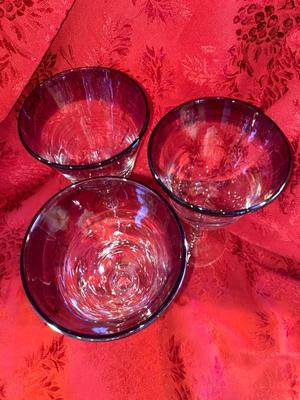 CRYSTAL PITCHER AND LARGE GLASS STEMMED GLASSES WITH PURPLE RIM