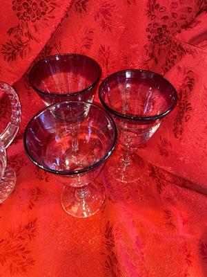 CRYSTAL PITCHER AND LARGE GLASS STEMMED GLASSES WITH PURPLE RIM