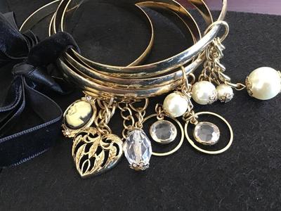 5 Gold Tone Bangle's with Charms