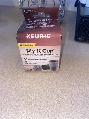 KEURIG COFFEE MAKER, KITTY CREAMER, AND TWO DIFFERENT COFFEE POD HOLDERS