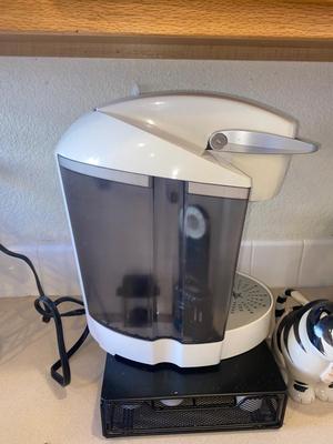 KEURIG COFFEE MAKER, KITTY CREAMER, AND TWO DIFFERENT COFFEE POD HOLDERS