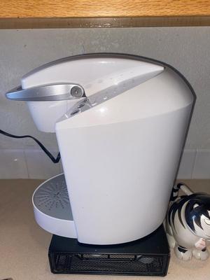 KEURIG COFFEE MAKER, KITTY CREAMER, AND TWO DIFFERENT COFFEE POD HOLDERS