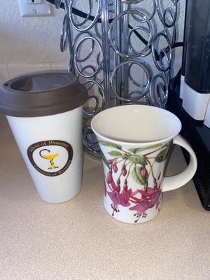 KEURIG COFFEE MAKER, KITTY CREAMER, AND TWO DIFFERENT COFFEE POD HOLDERS