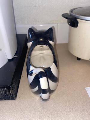 KEURIG COFFEE MAKER, KITTY CREAMER, AND TWO DIFFERENT COFFEE POD HOLDERS