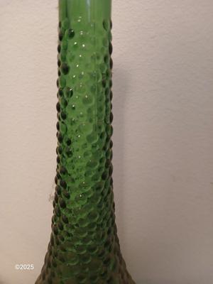 Three Unique glass bottles with two metal tabletop wine racks