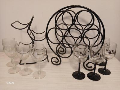 Eight wine glasses and two metal tabletop wine racks