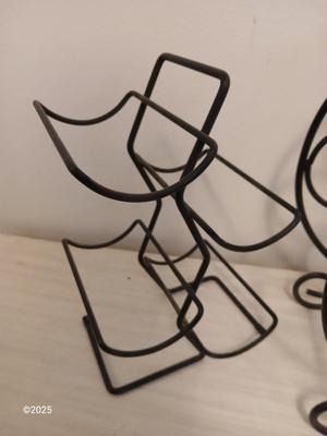 Eight wine glasses and two metal tabletop wine racks