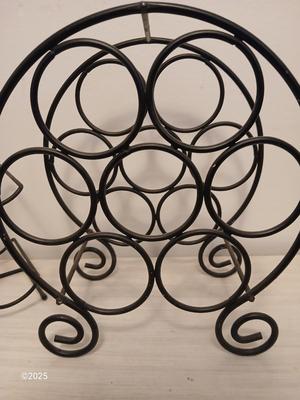 Eight wine glasses and two metal tabletop wine racks
