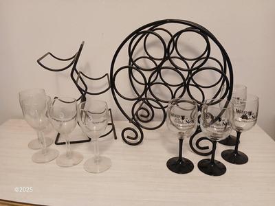 Eight wine glasses and two metal tabletop wine racks