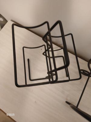 Eight wine glasses and two metal tabletop wine racks