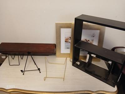 Wall shelf, wall ledge, picture frames and three plate stands