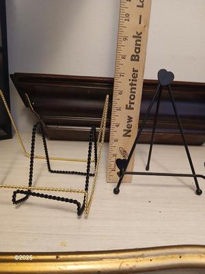 Wall shelf, wall ledge, picture frames and three plate stands