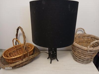 Variety of baskets and a lamp with a large lampshade