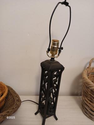 Variety of baskets and a lamp with a large lampshade