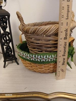 Variety of baskets and a lamp with a large lampshade
