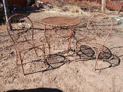 Metal bistro table with two chairs