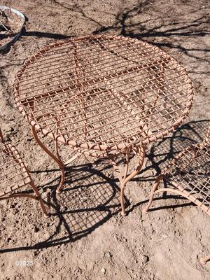 Metal bistro table with two chairs
