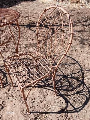Metal bistro table with two chairs