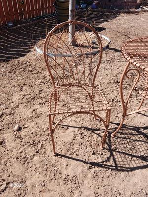 Metal bistro table with two chairs