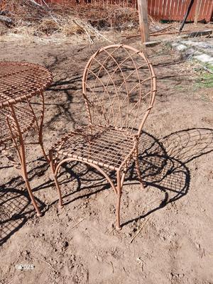 Metal bistro table with two chairs