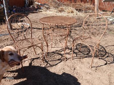 Metal bistro table with two chairs