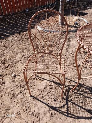 Metal bistro table with two chairs