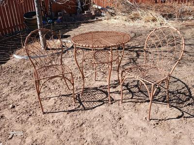 Metal bistro table with two chairs