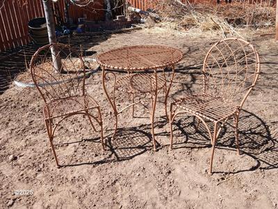 Metal bistro table with two chairs