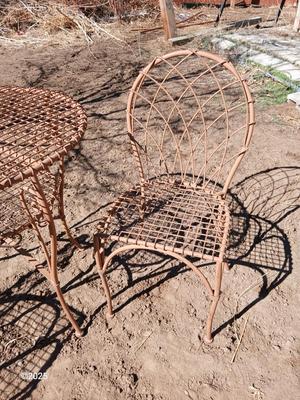 Metal bistro table with two chairs