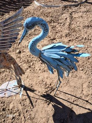 Two metal yard art birds