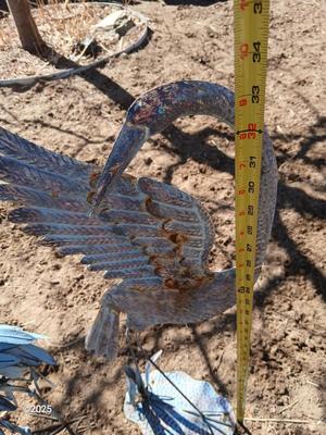 Two metal yard art birds