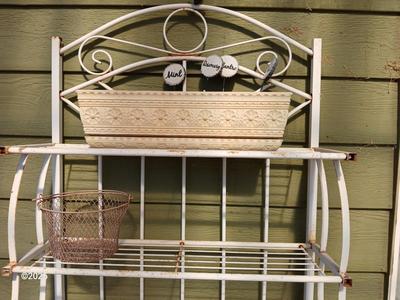Metal bakers rack style planting station with flowerpot and more