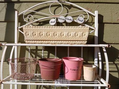 Metal bakers rack style planting station with flowerpot and more