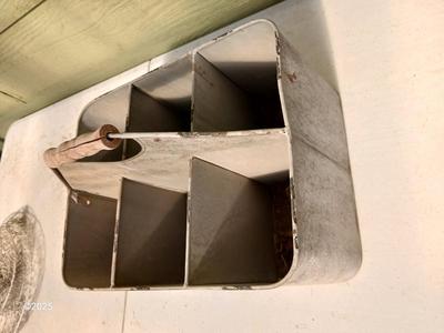 Six slot galvanized metal storage bin with three-tiered mesh hanging baskets