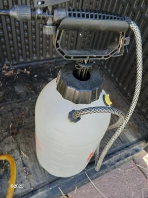 Sola backpack style weed sprayer and a handheld HDX pump weed sprayer