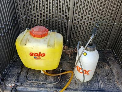Sola backpack style weed sprayer and a handheld HDX pump weed sprayer